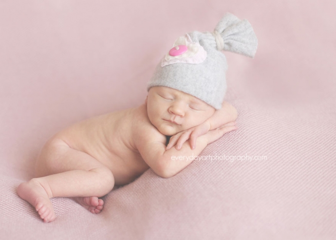 newborn baby with upcycled hat